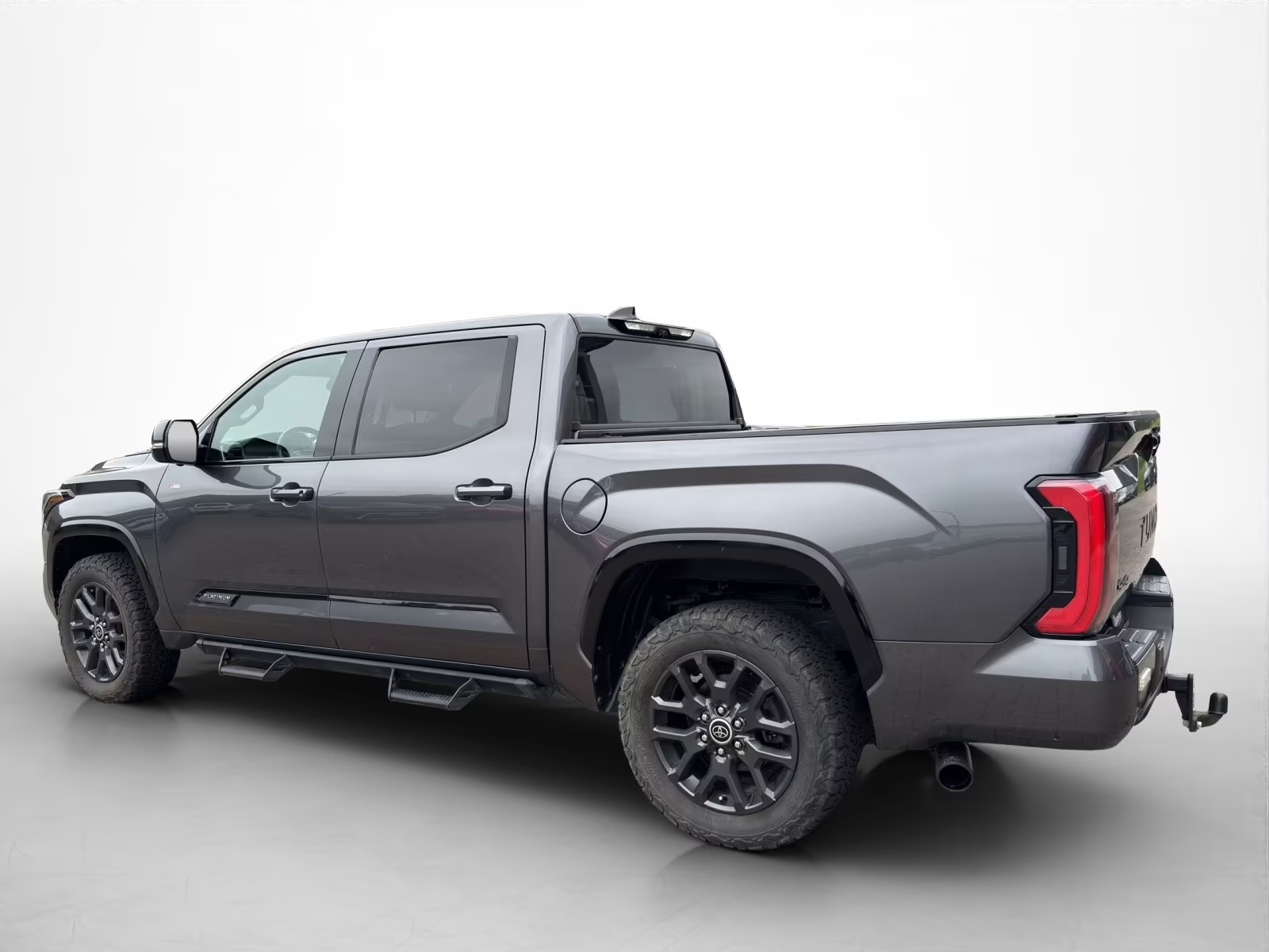 Rear side profile of the Toyota Tundra Platinum with composite bed and tow hitch.