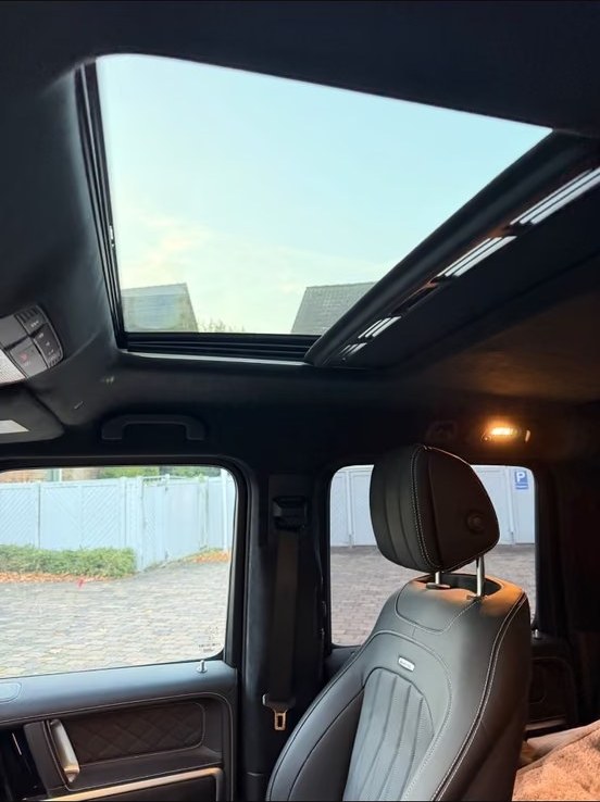 Open sunroof and front seat detail inside the Mercedes-AMG G 63.