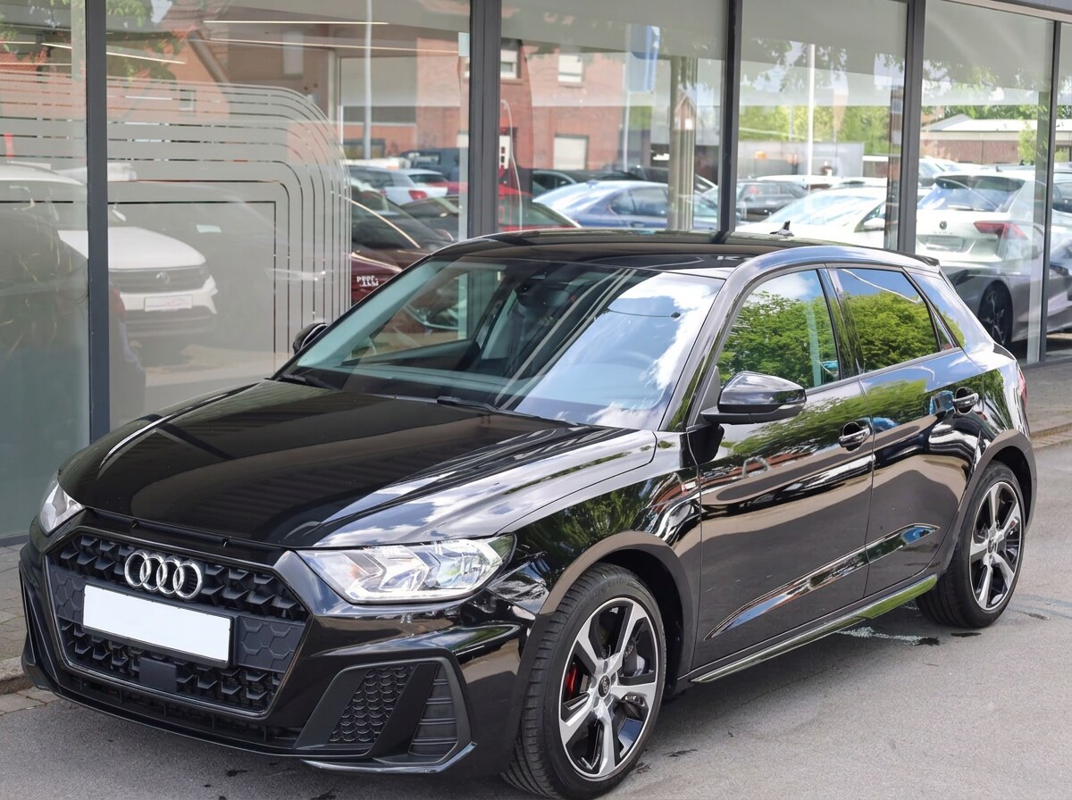 Front three-quarter view of the black Audi A1 Sportback S line.