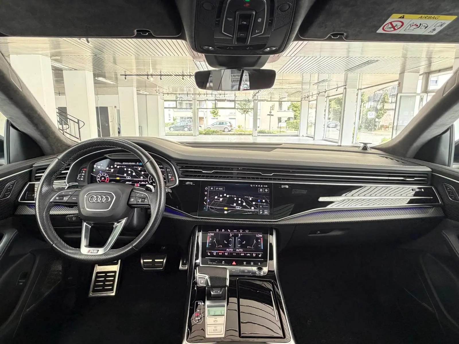 Dashboard of the Audi RS Q8 showing the dual MMI touchscreens and leather-trimmed instrument panel.