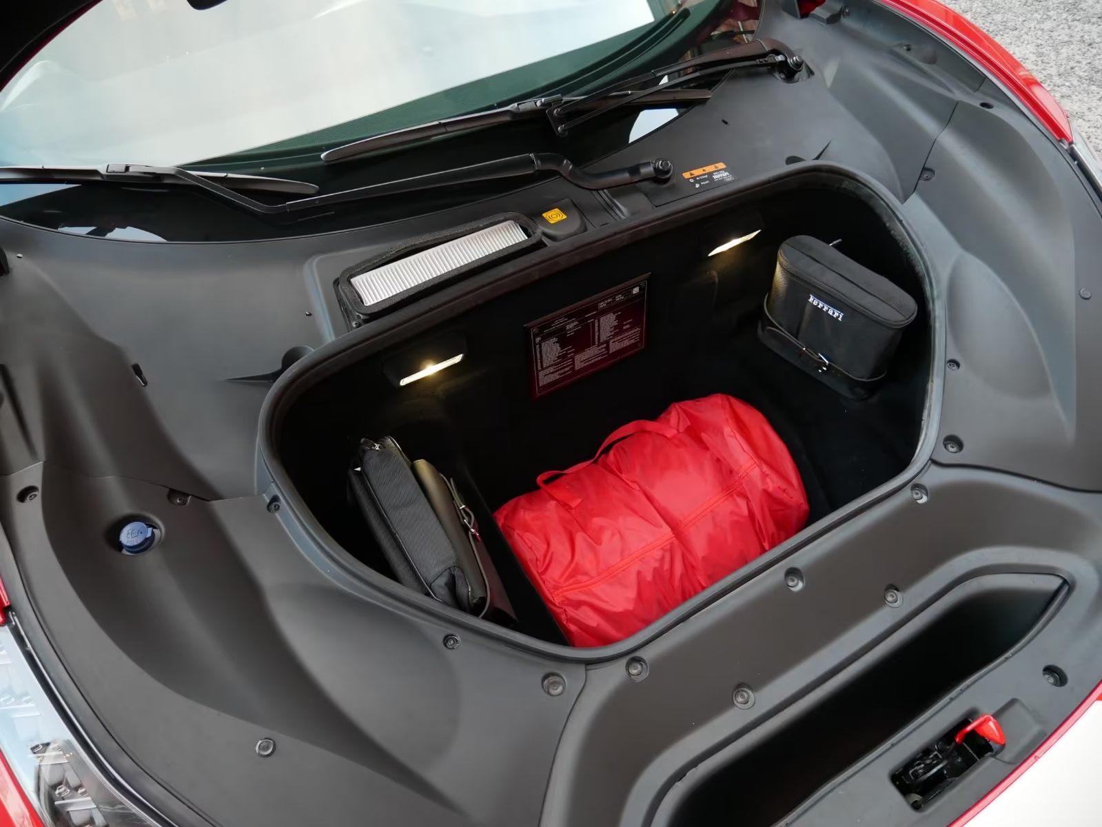 Ferrari 488 Pista Piloti #57 2019 — front luggage compartment with tool kit