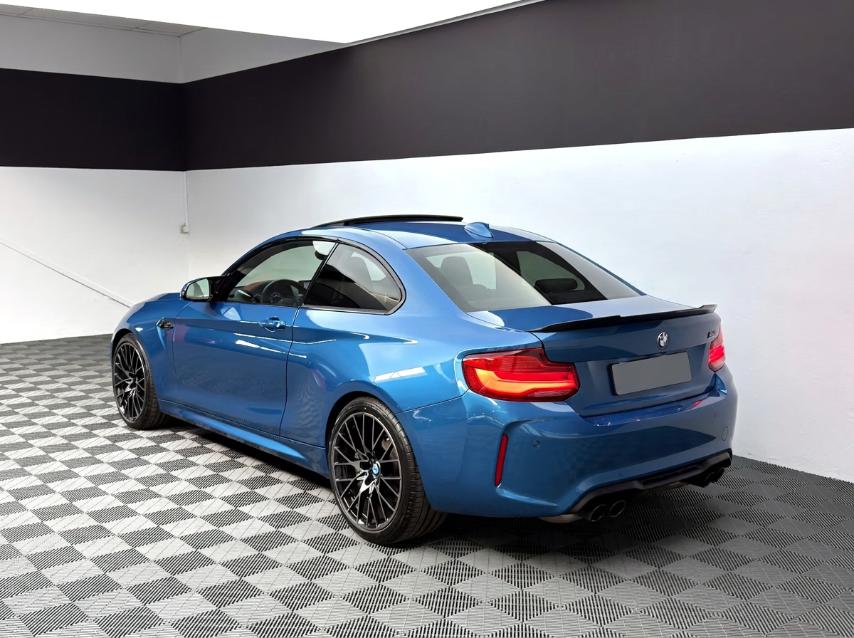 BMW M2 Competition — rear three-quarter view