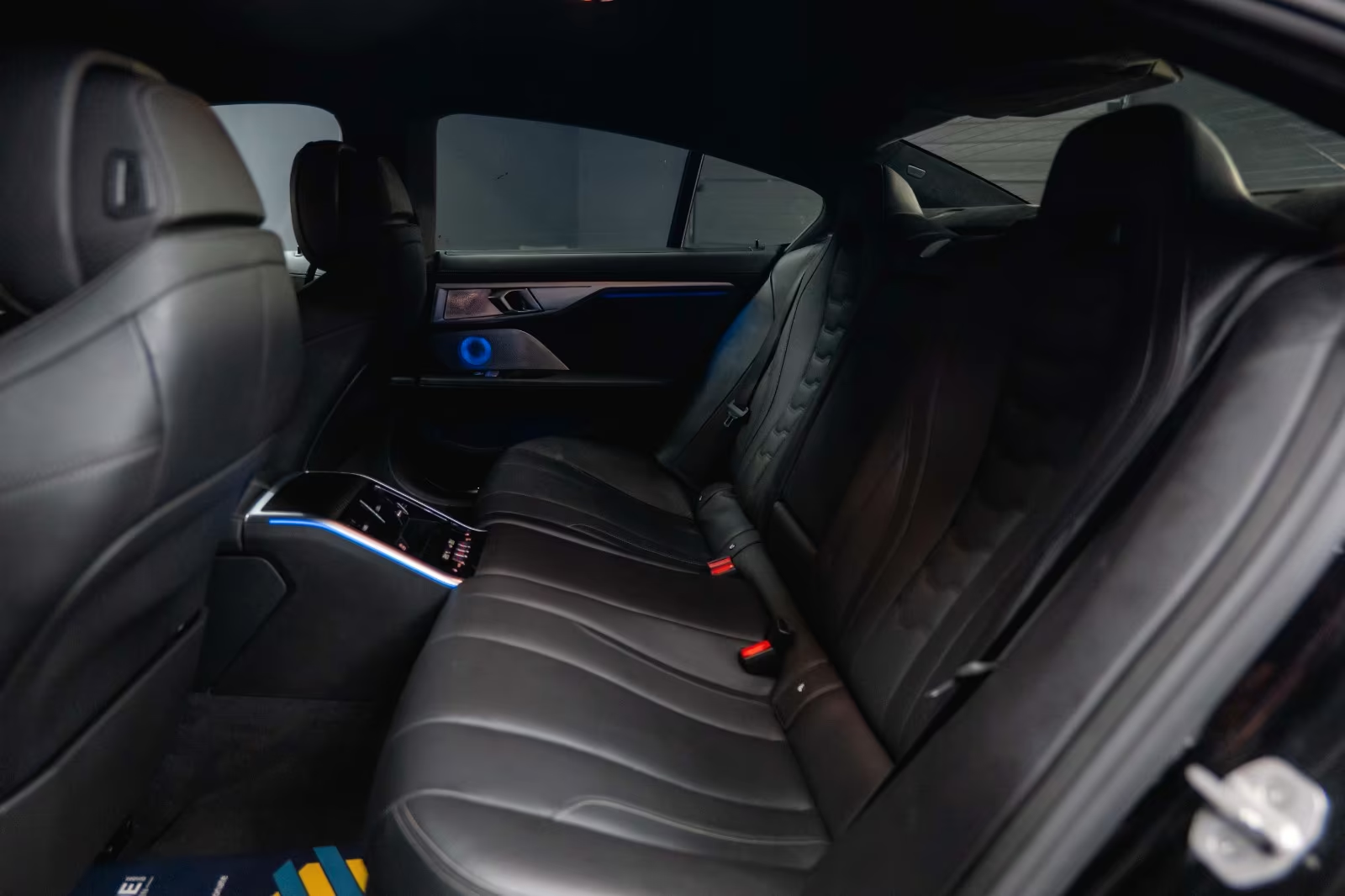 BMW M850i xDrive Gran Coupé — black leather rear seating