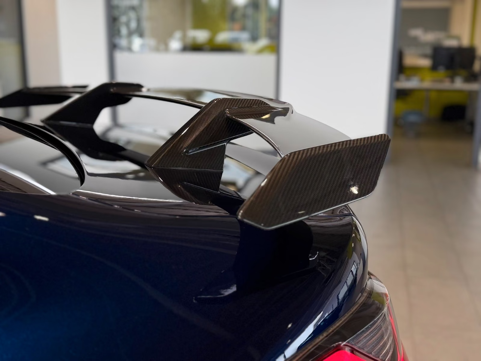BMW M4 Competition — carbon rear wing close-up