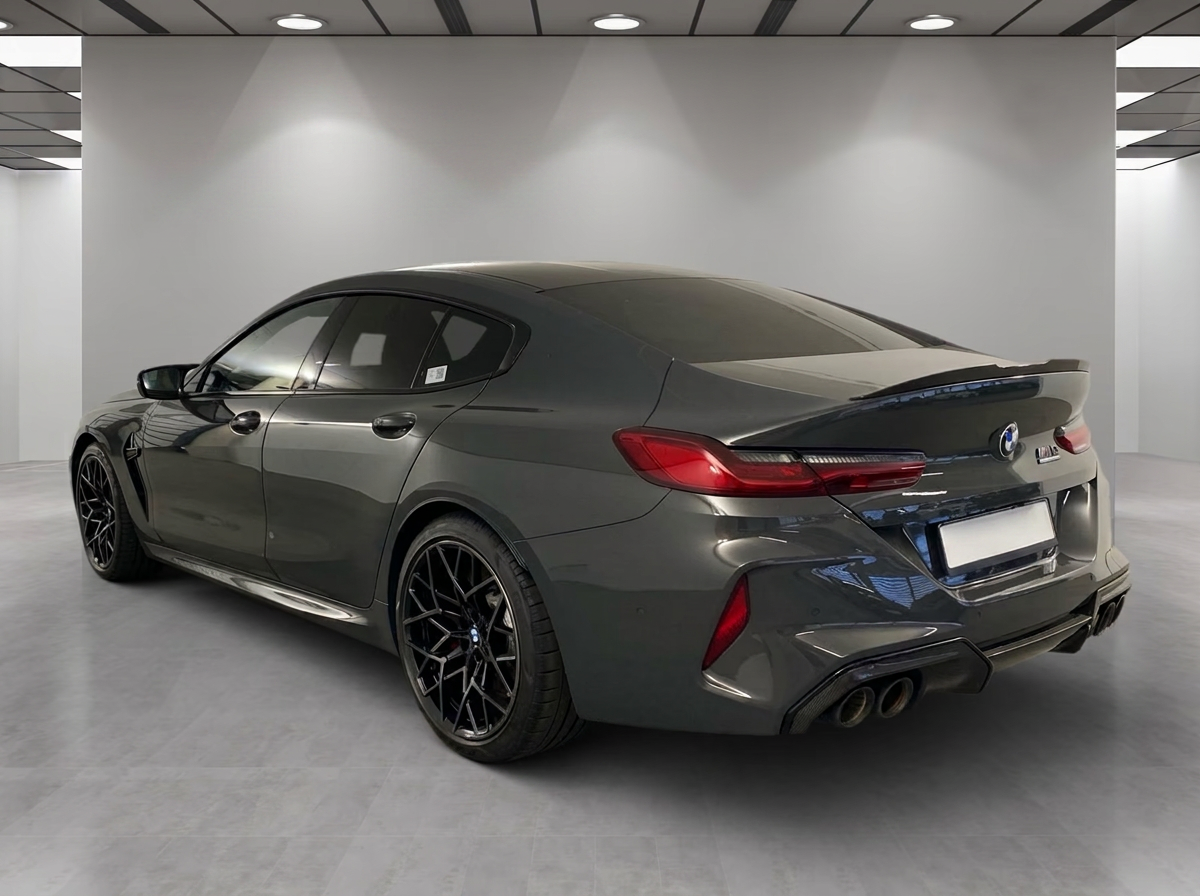 BMW M8 Competition Gran Coupé 2023 — rear profile with quad exhausts
