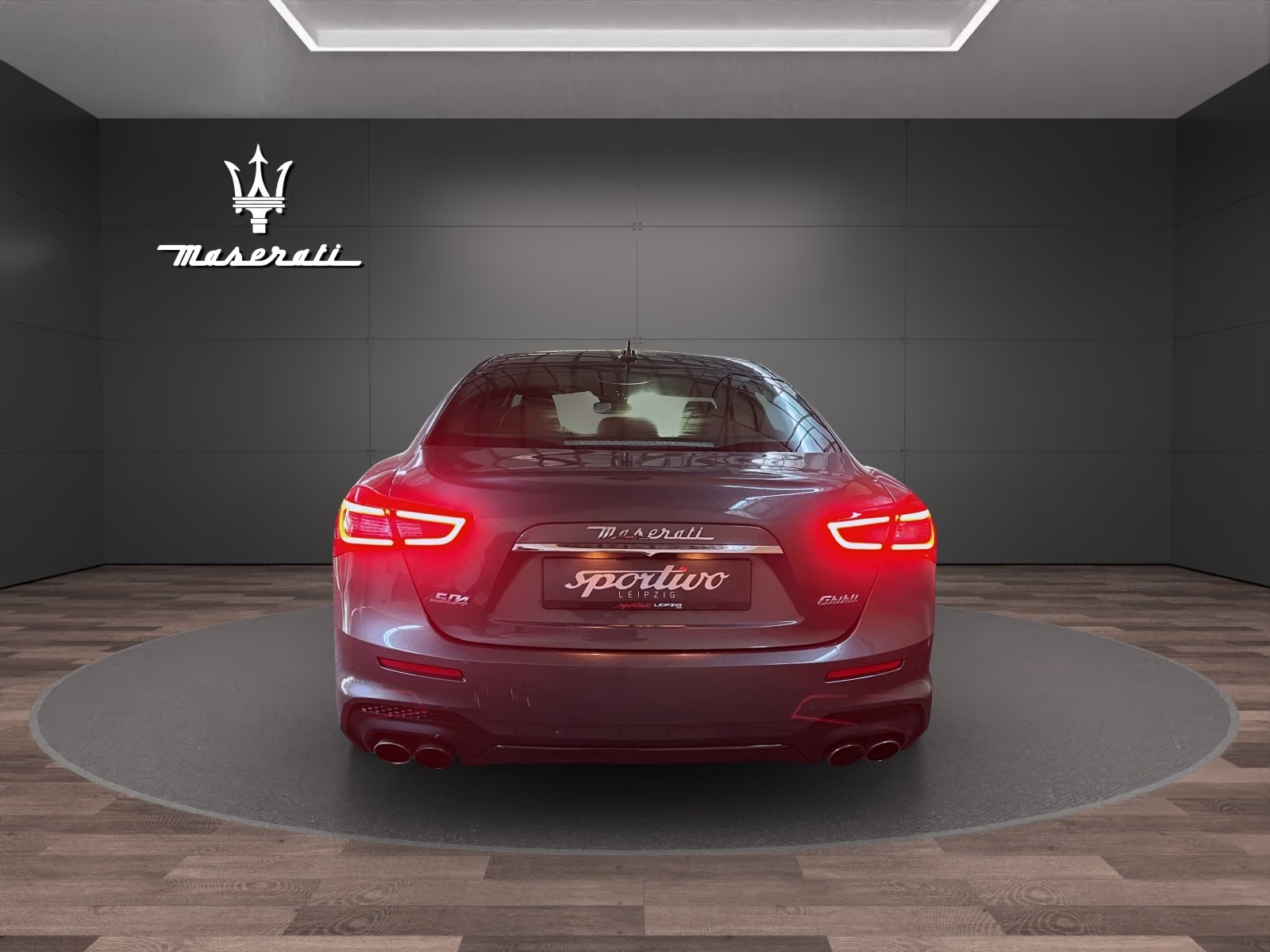 Rear view of the Maserati Ghibli S Q4 with quad exhaust tips and LED tail lights.