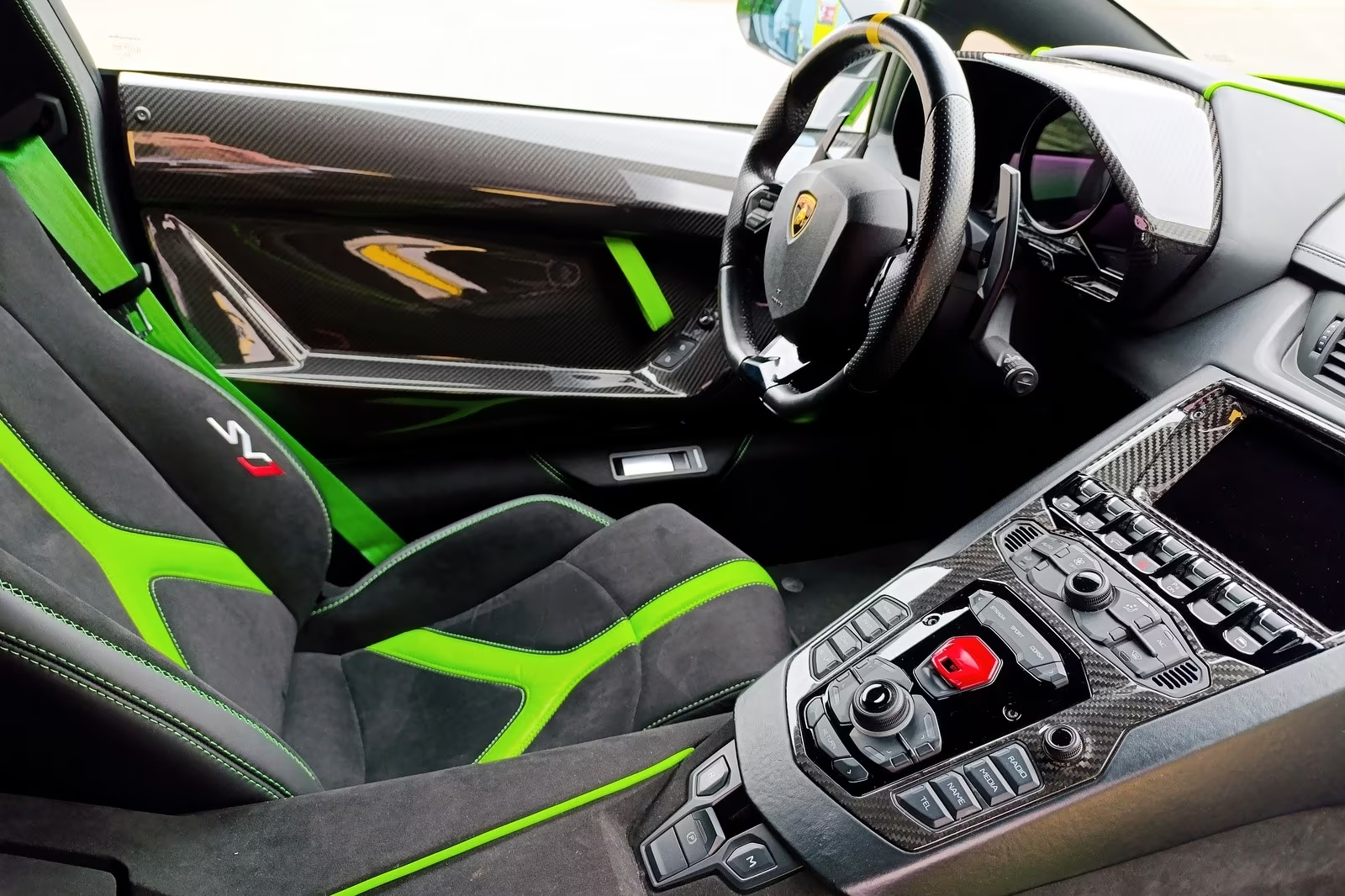 Lamborghini Aventador SVJ 2014 — black Alcantara cockpit with green accents and carbon trim