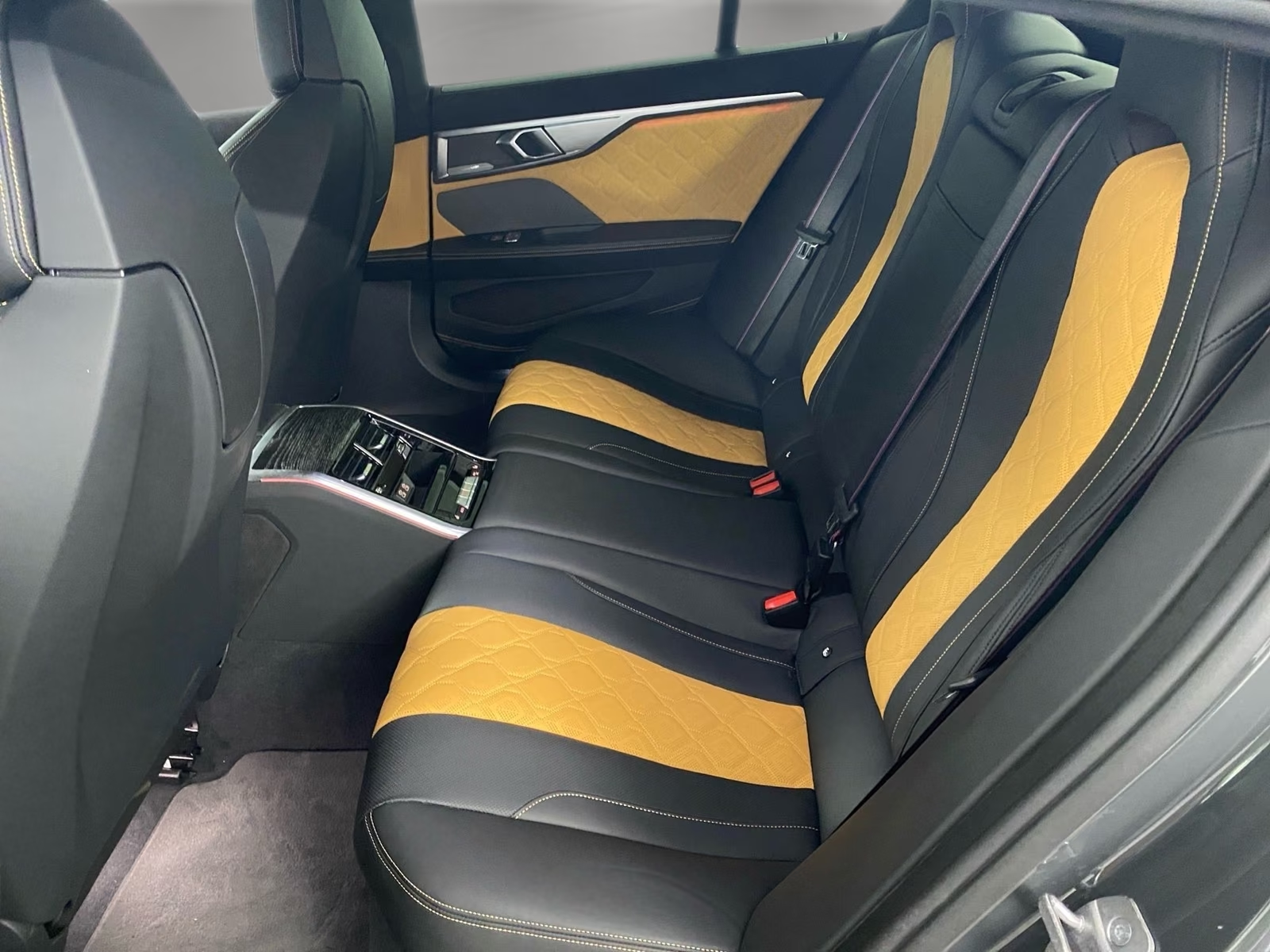 BMW M8 Competition Gran Coupé 2023 — rear seats in black and beige Merino leather