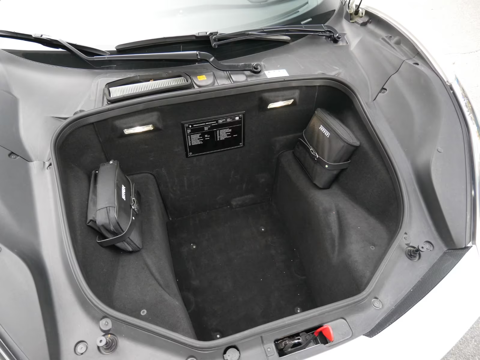 Ferrari 488 Spider Novitec 2017 — front luggage compartment with Ferrari kit bags