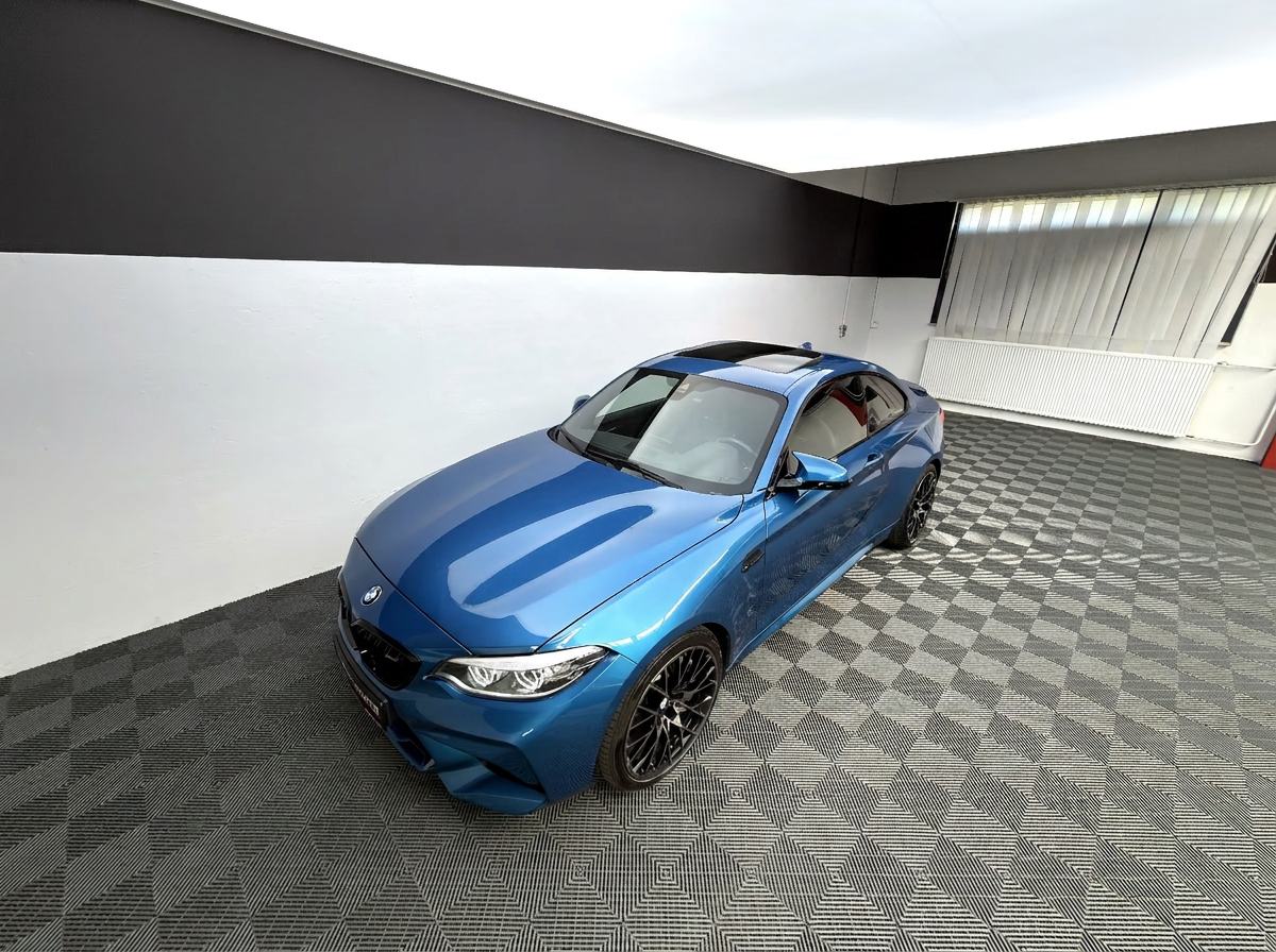 BMW M2 Competition in Long Beach Blue — front three-quarter view