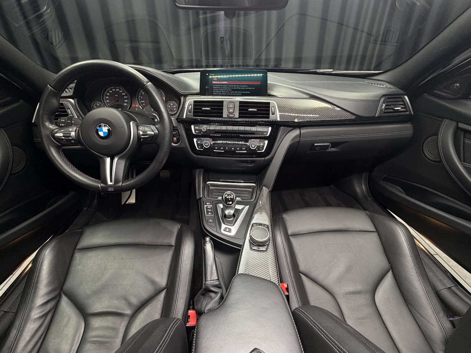 BMW M3 Competition F80 — cockpit with carbon trim