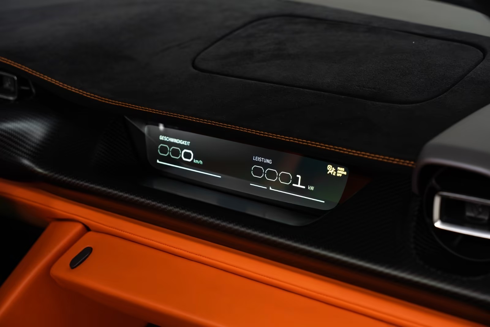 Detail of the Rimac Nevera passenger display showing speed and power readouts.