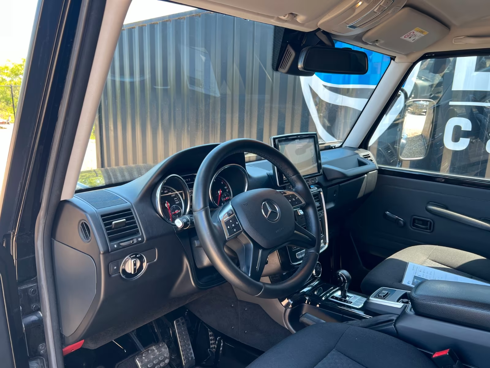 Mercedes-Benz G 350 d Professional 2018 — driver's cockpit with leather steering wheel