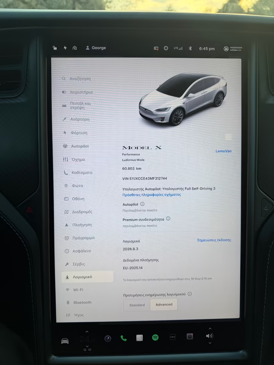 Tesla Model X central touchscreen showing vehicle information and software details.