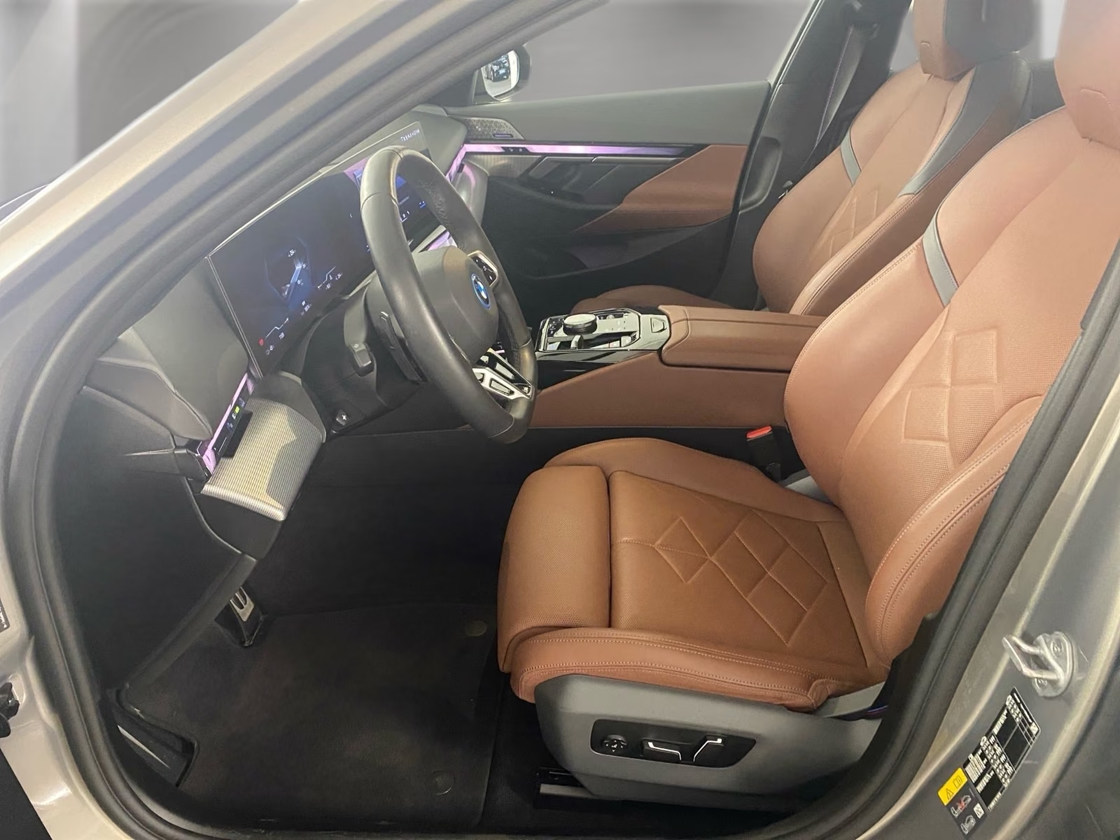 Front seats in Copper Brown BMW Individual Merino leather with Atlas Grey accents.