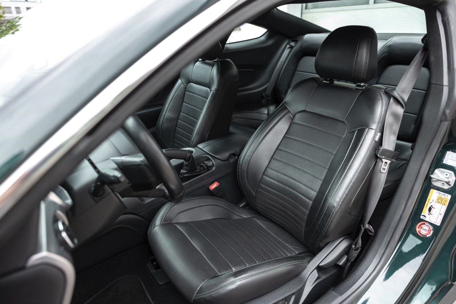 Black leather front sport seats of the Ford Mustang Bullitt.
