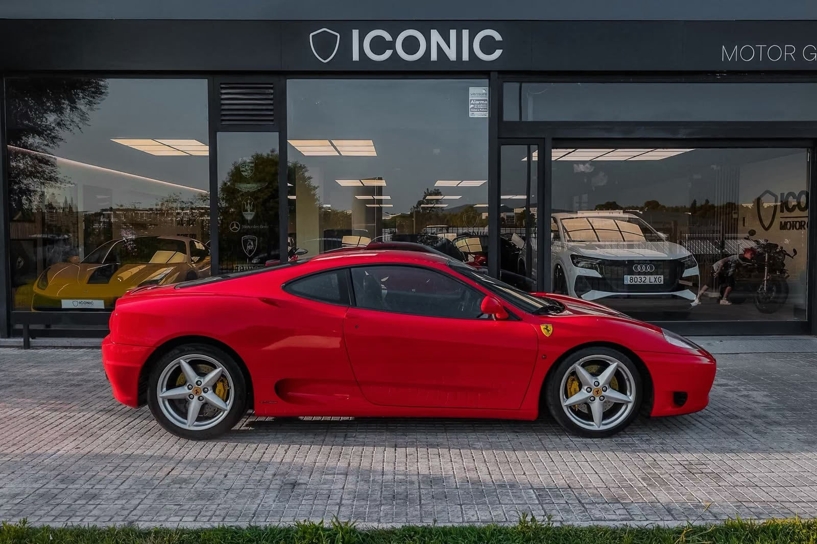 Ferrari 360 Modena 2001 — side profile in Rosso Corsa