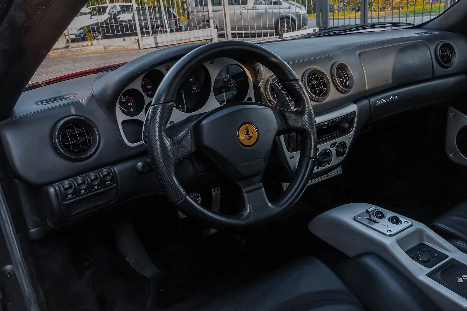 Ferrari 360 Modena 2001 — black leather dashboard and steering wheel