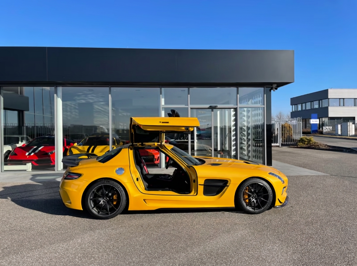 Mercedes-Benz SLS AMG Black Series in SOLARBEAM yellow, side view with gullwing doors open