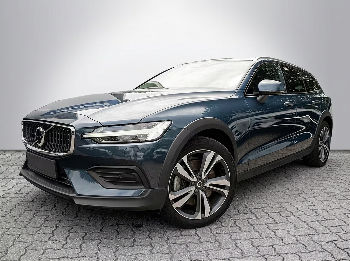 Volvo V60 Cross Country B5 in Denim Blue, front three-quarter view in a studio