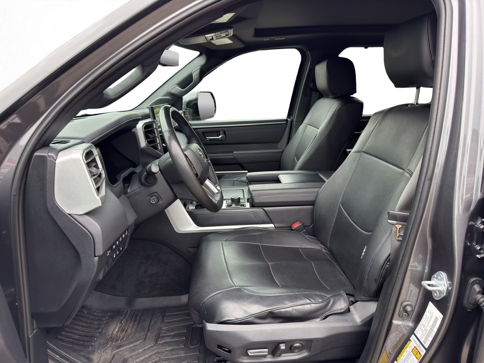 Black leather front seats and cabin of the Toyota Tundra Platinum.