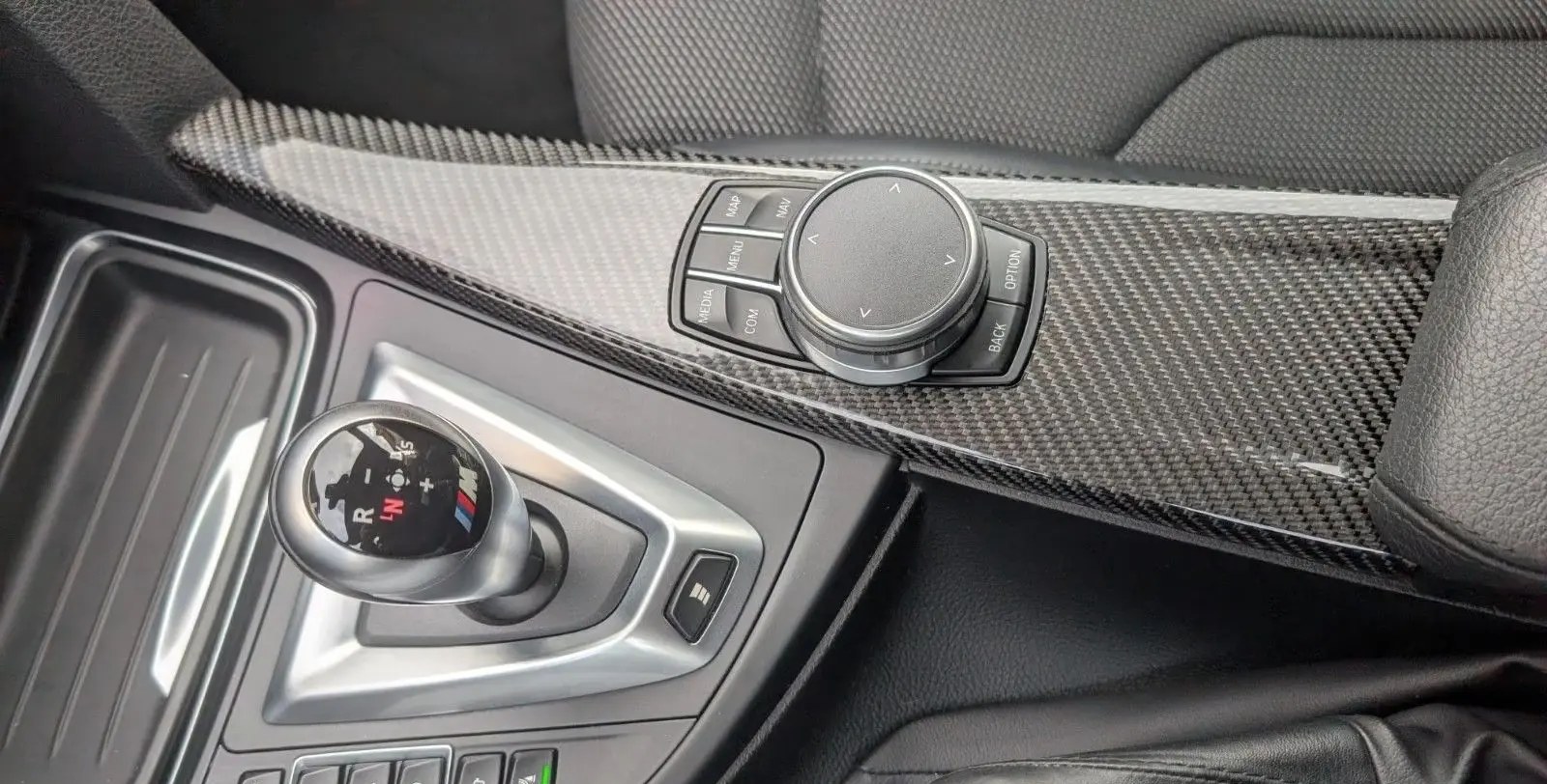 Carbon centre console with M DCT selector and iDrive controller.