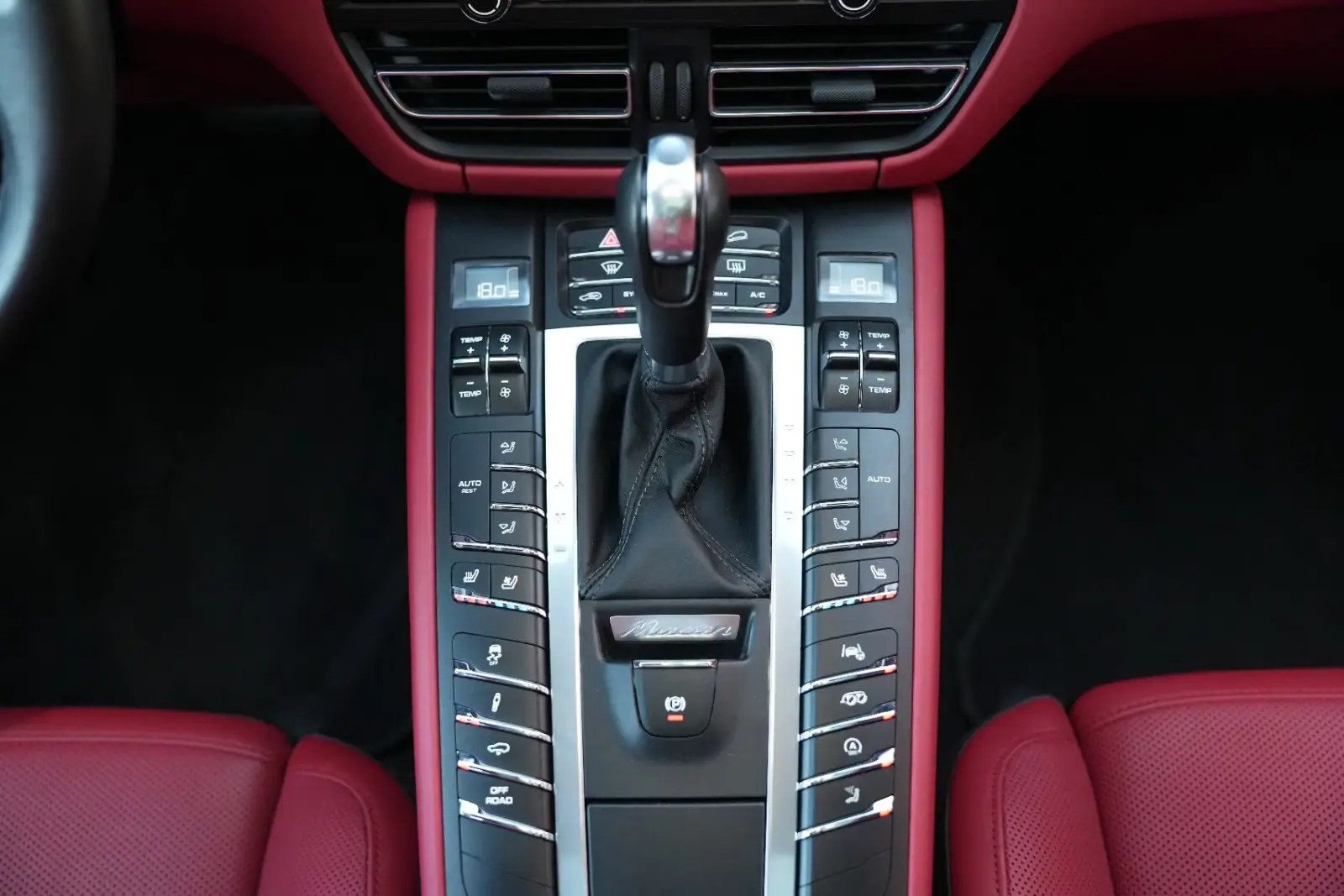 Cockpit with steering wheel and red leather trim