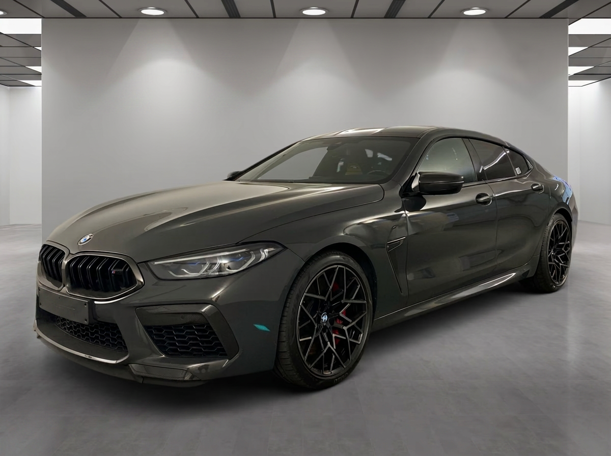 BMW M8 Competition Gran Coupé 2023 in Dravitgrau — front three-quarter view