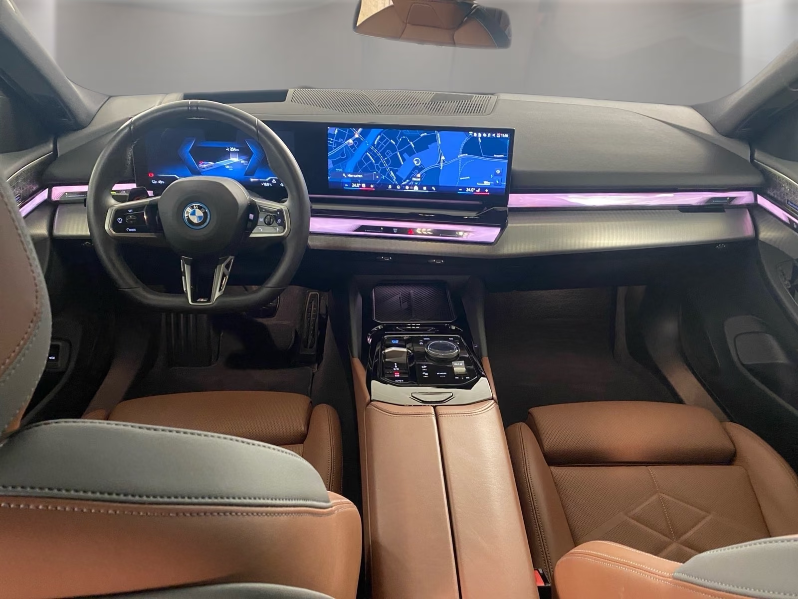 Full dashboard with curved display, ambient lighting and centre console.