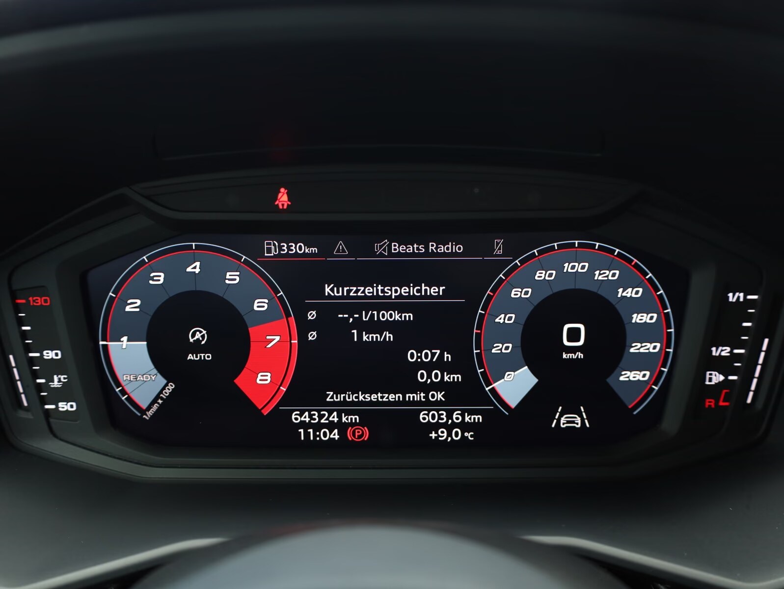 Audi virtual cockpit showing the vehicle mileage of 64,324 km.