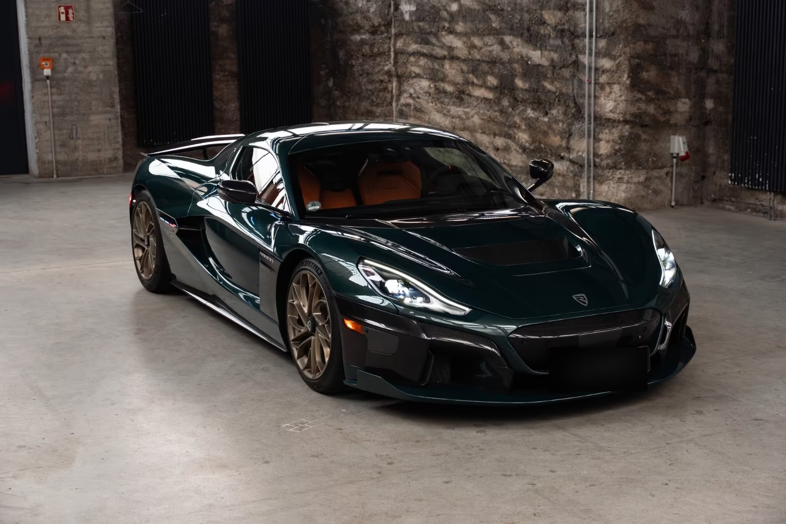 Front three-quarter view of the Rimac Nevera showing the carbon front splitter.