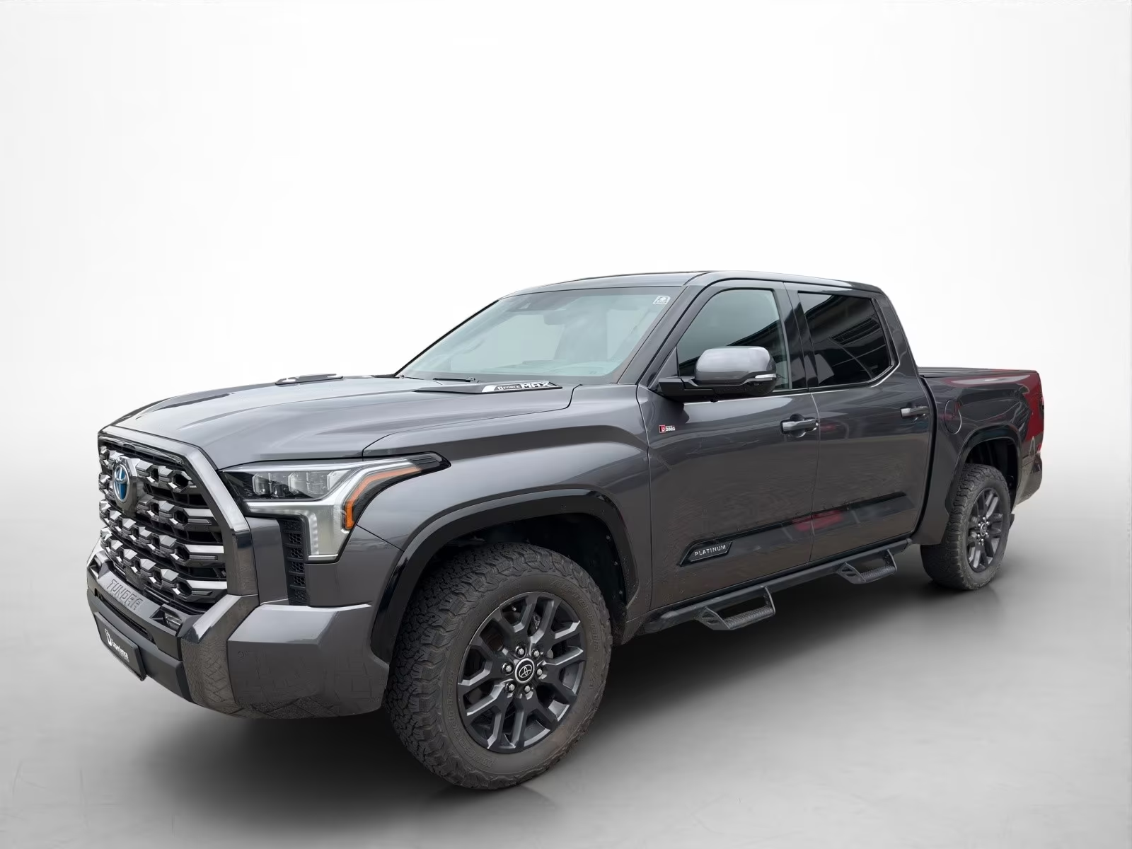 Front three-quarter studio view of the grey Toyota Tundra Platinum CrewMax.