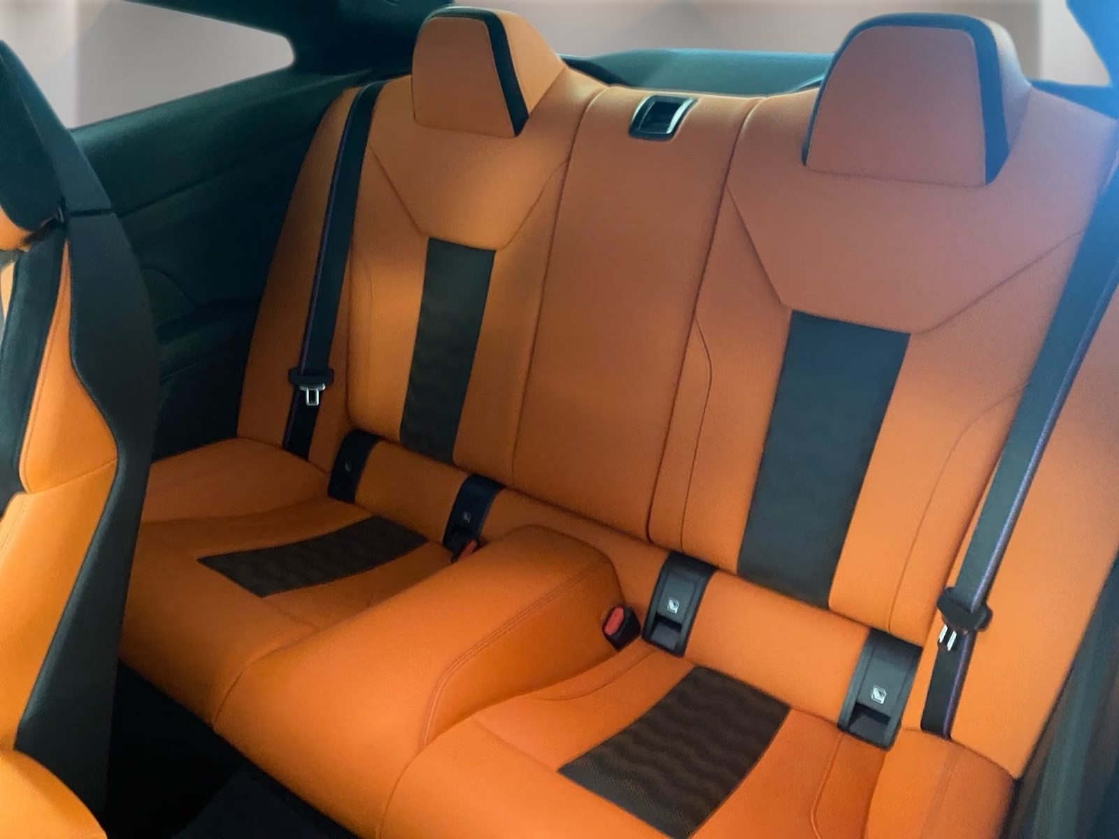 Rear seats in Kyalami Orange and Black Merino leather.