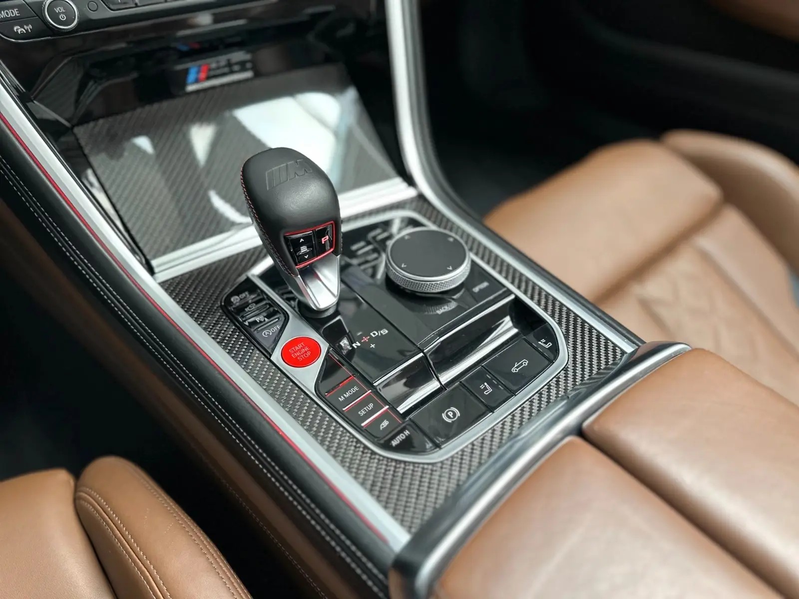 Carbon centre console of the BMW M8 with the M gear selector, Start Engine Stop button and M Mode controls.