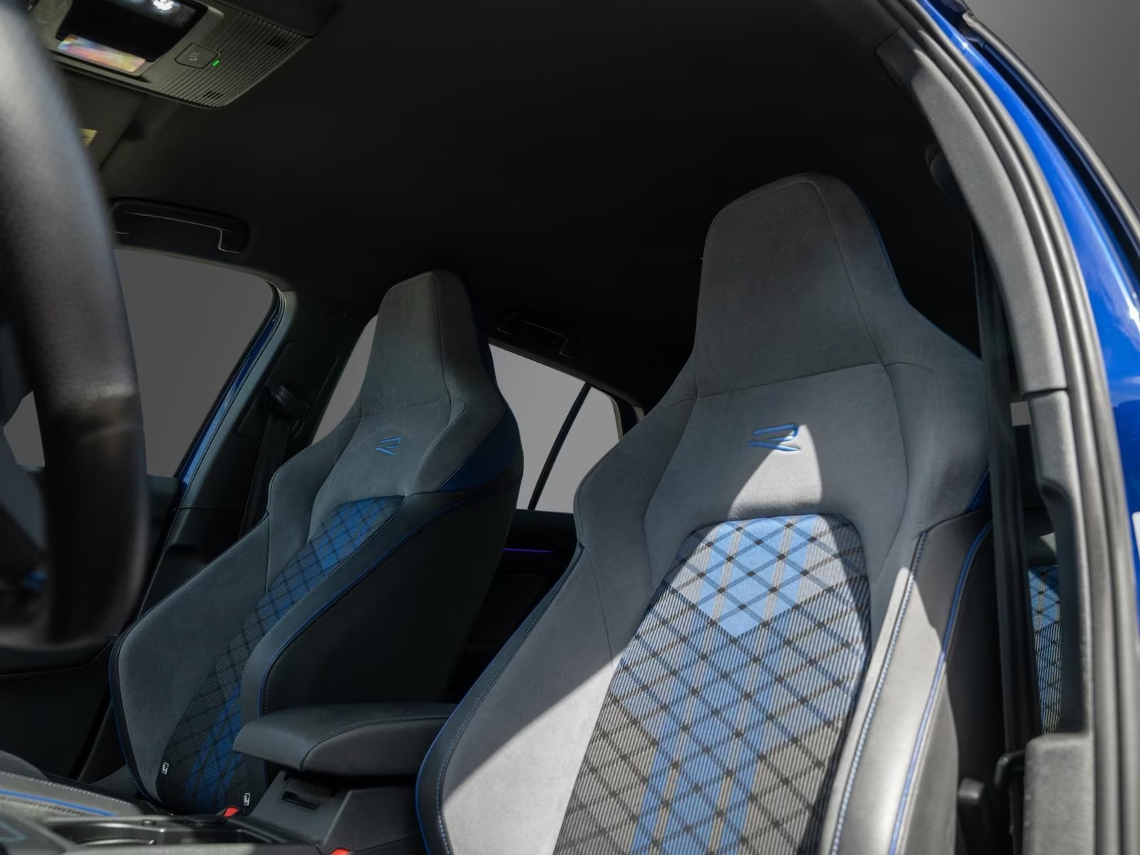 Volkswagen Golf R front top sport seats in ArtVelours with blue tartan inserts.