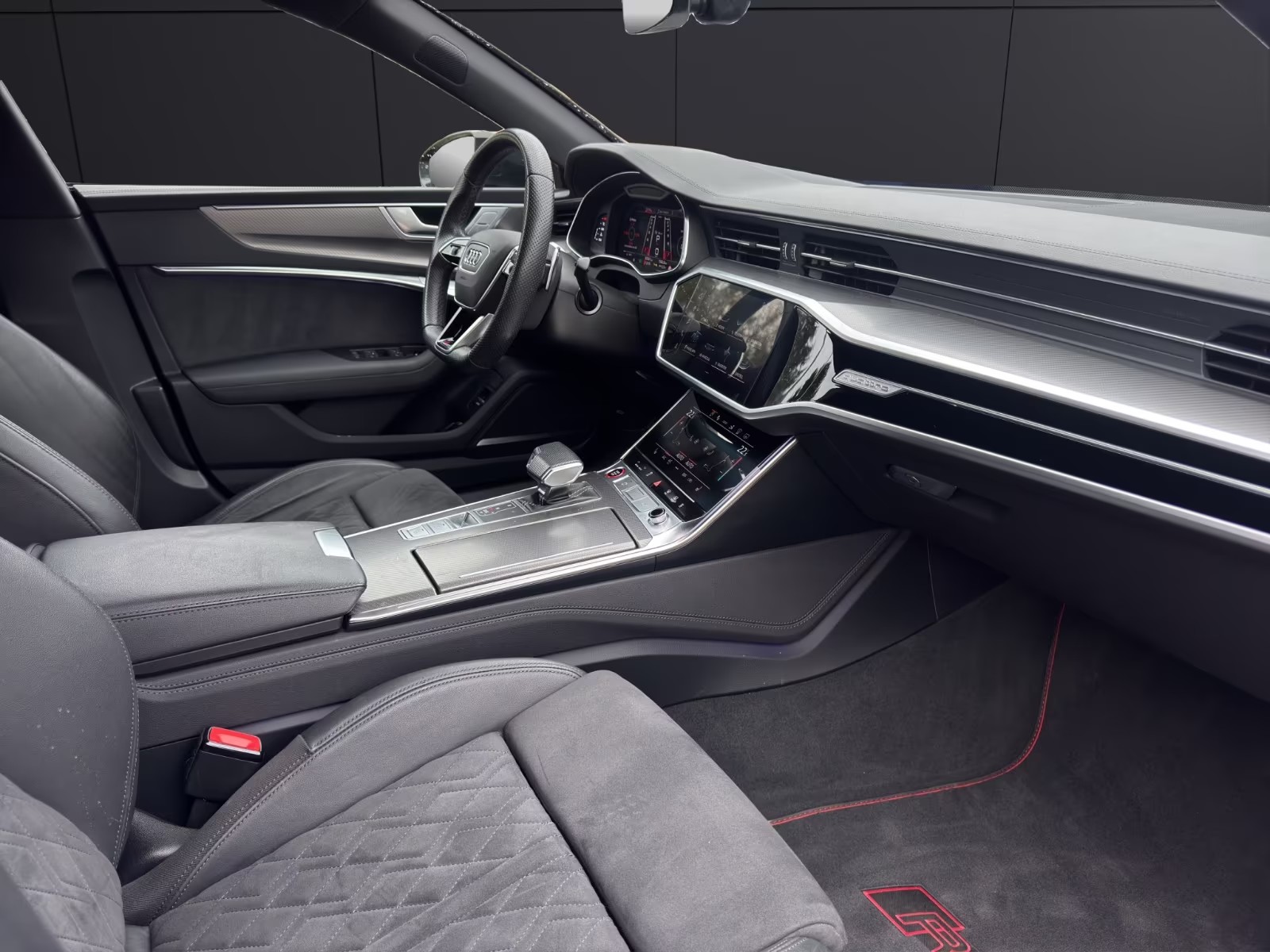 Interior view of the Audi RS7 from the passenger side showing the gear selector and Alcantara seats.