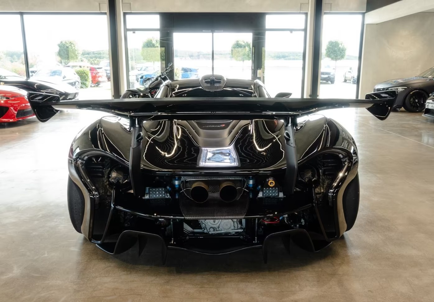 Rear view of the McLaren P1 GTR showing the diffuser, centrally mounted twin exhaust and wing supports.