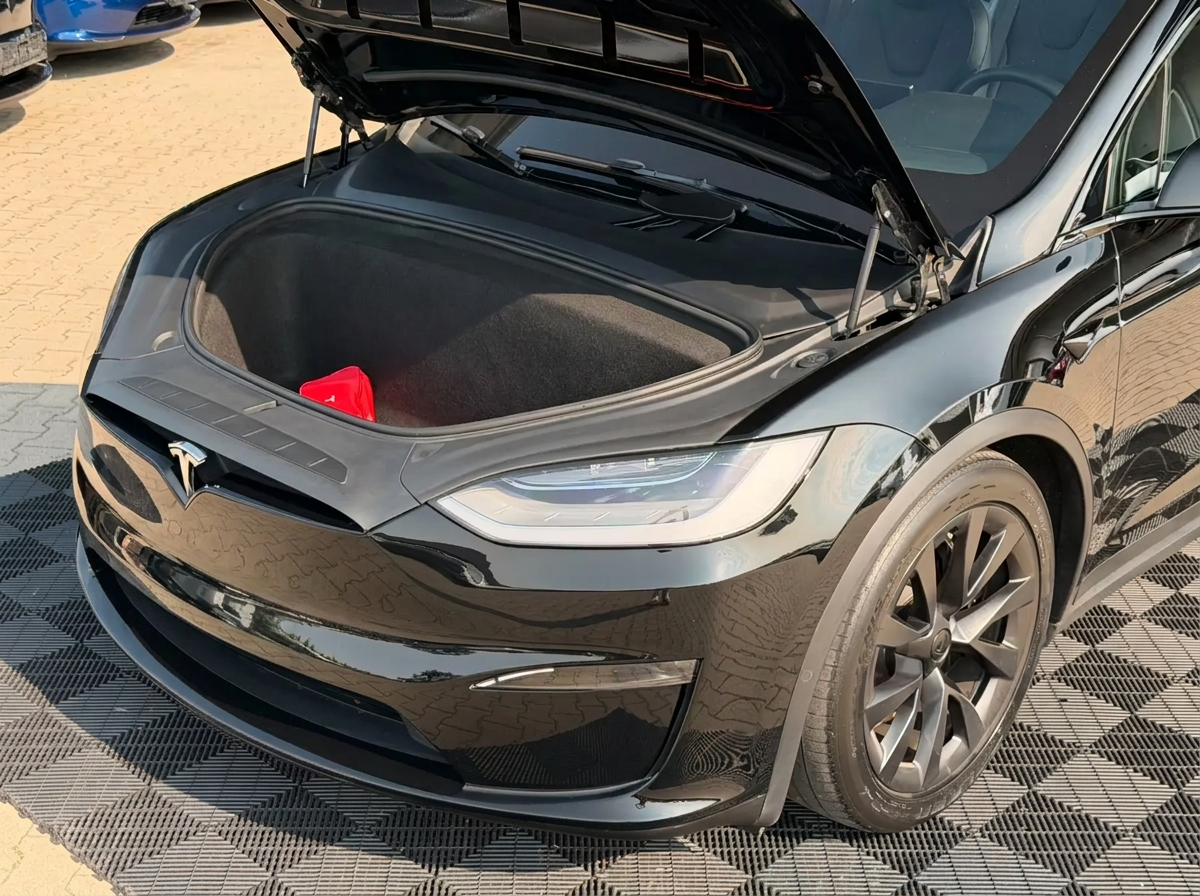 Open front trunk (frunk) of the Tesla Model X.
