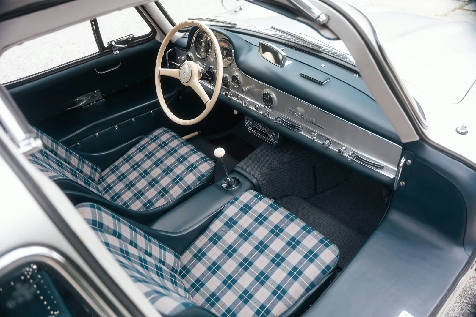 Overhead view of the blue and plaid Mercedes-Benz 300 SL interior