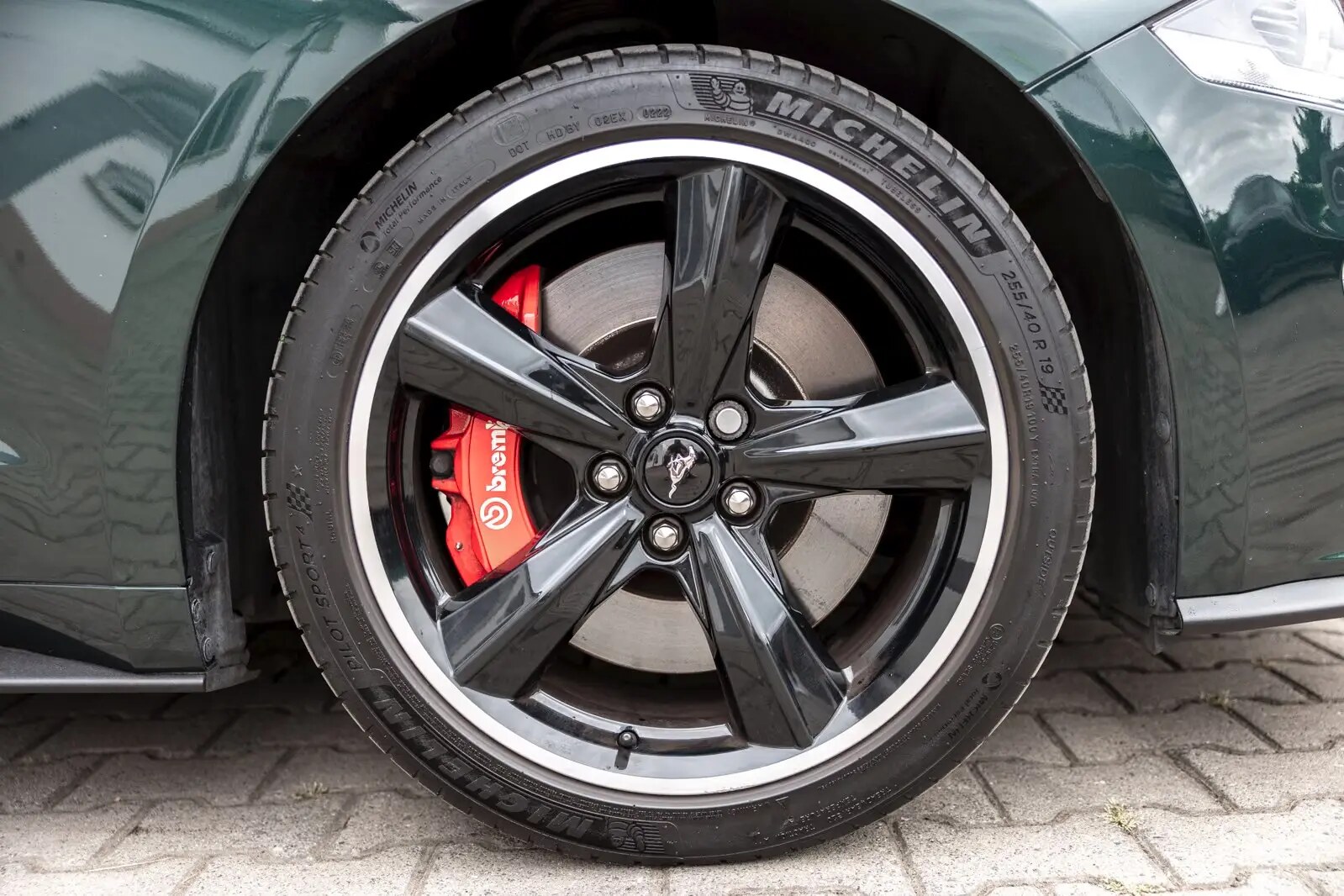 Black Bullitt alloy wheel with red Brembo brake caliper and Michelin Pilot Sport tyre.