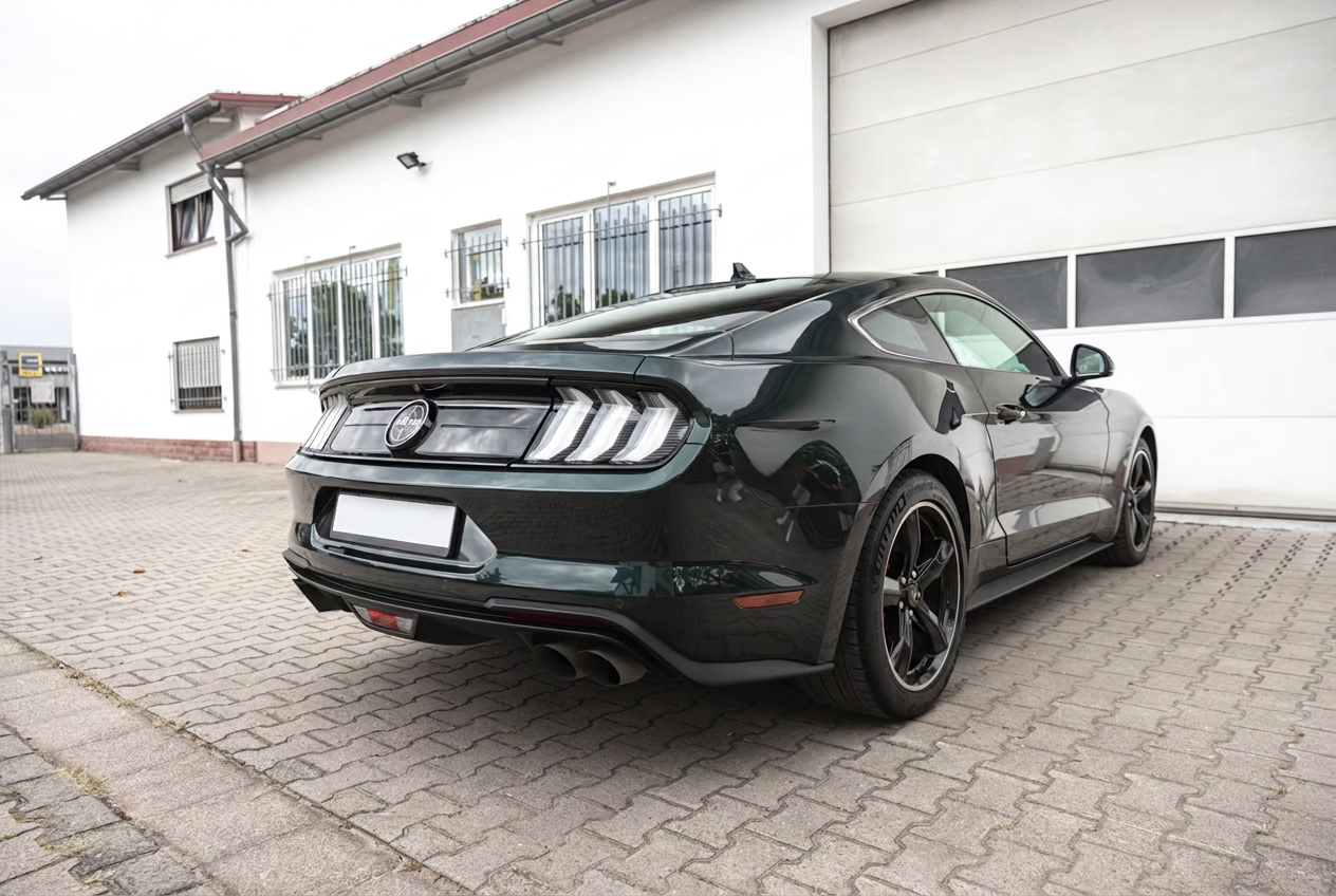 Rear three-quarter view of the Ford Mustang Bullitt with LED tail lights and quad exhausts.