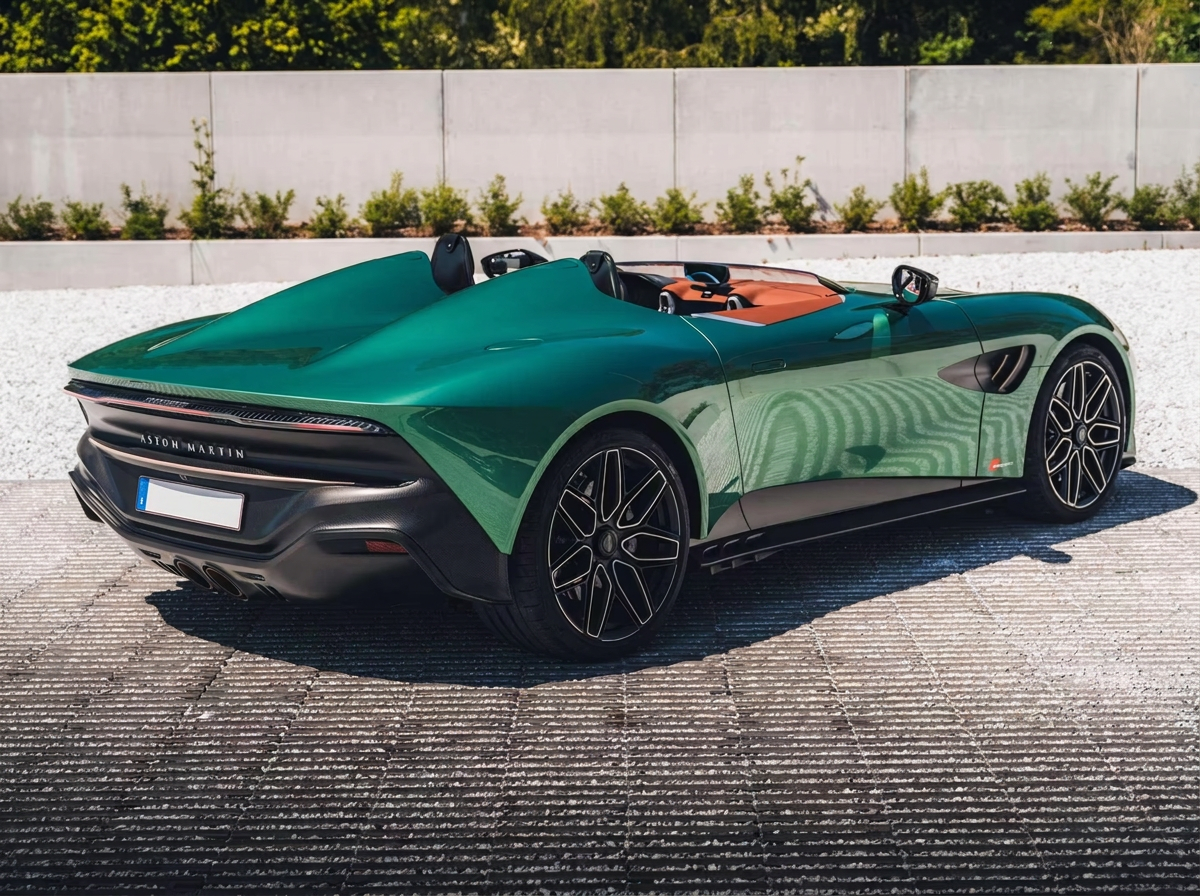 Rear three-quarter view of the green Aston Martin DBR22 speedster showing the twin humps and carbon diffuser.