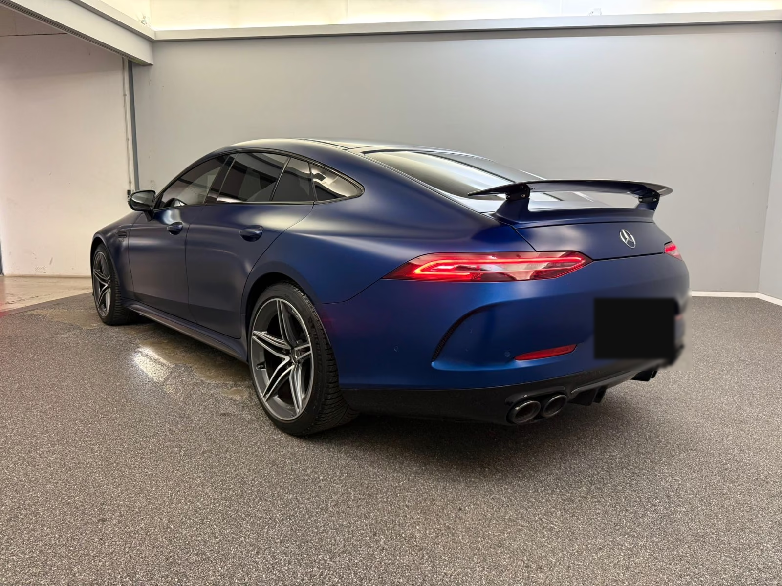 Mercedes-AMG GT 43 4MATIC+ 2020 — rear three-quarter view with quad exhausts and rear wing