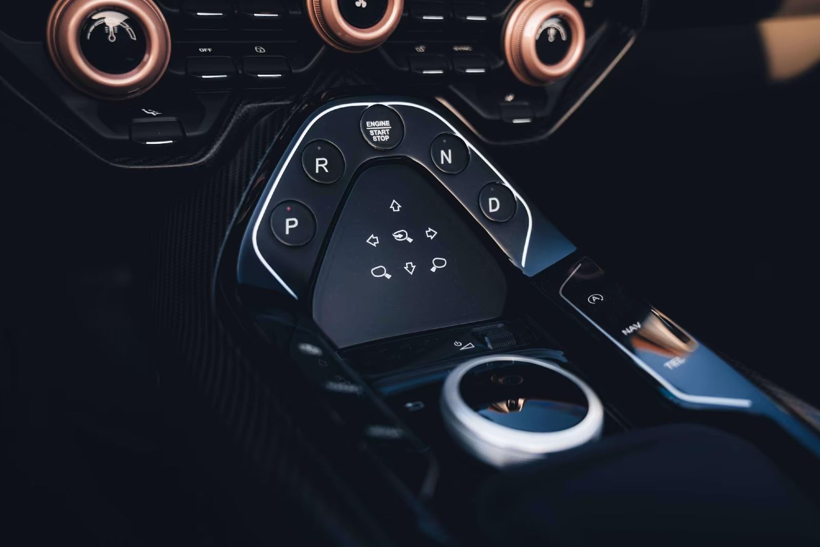 Detail of the DBR22 centre console with engine start button and PRND transmission controls.