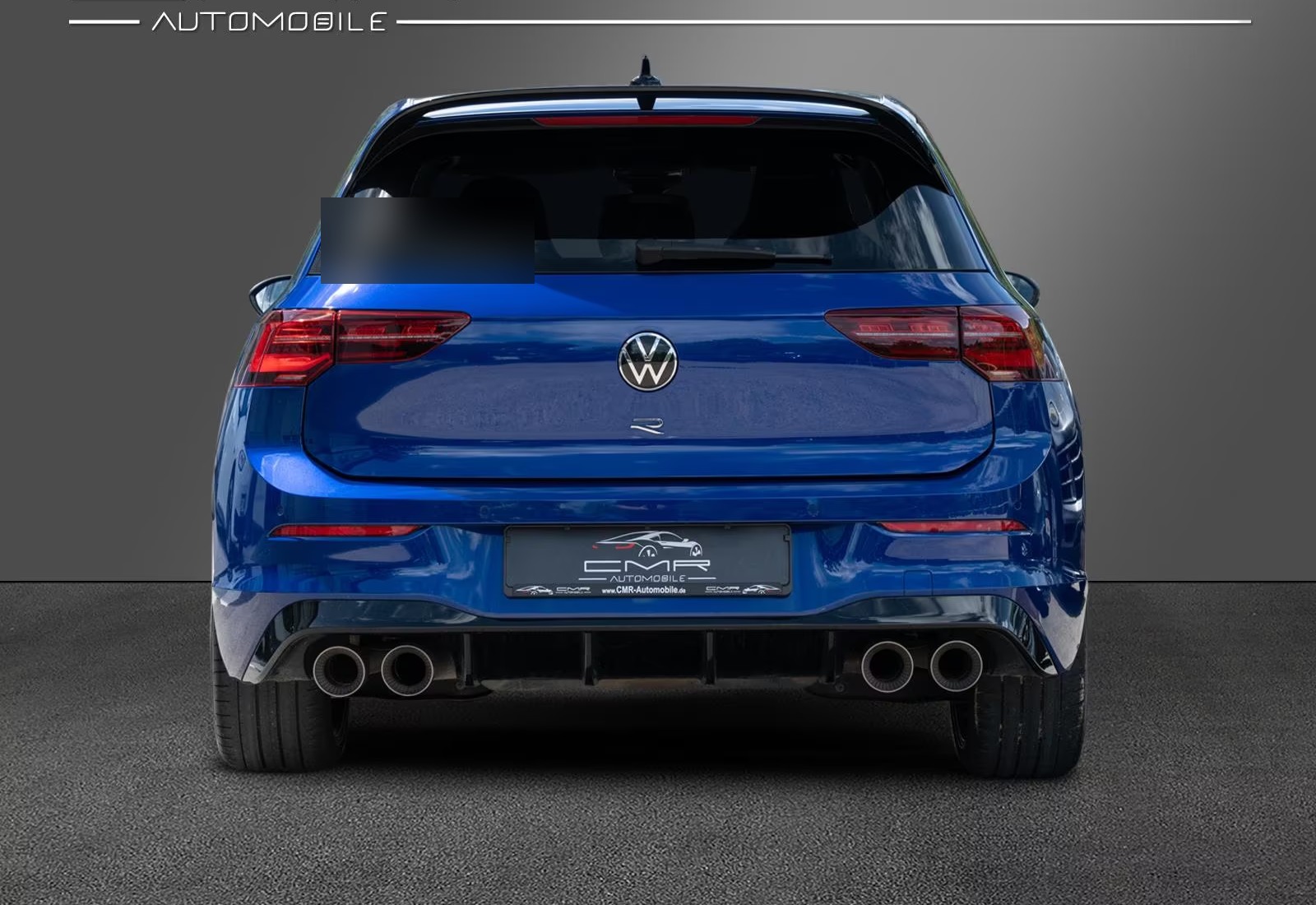 Straight rear view of the Volkswagen Golf R with LED tail lights and motorsport roof spoiler.