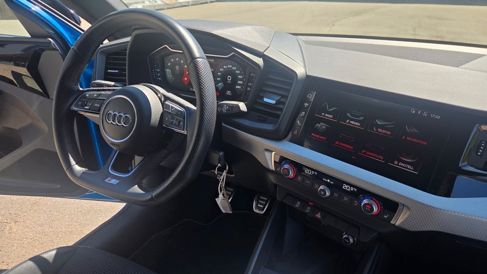 Dashboard of the Audi A1 showing the virtual cockpit, MMI touchscreen and climate controls.