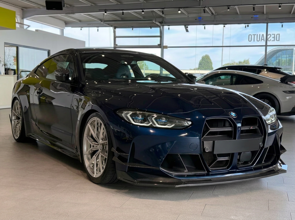 BMW M4 Competition — front three-quarter view with carbon aero package