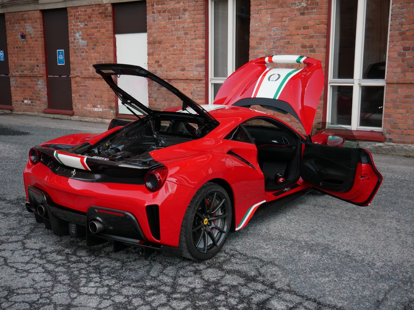 Ferrari 488 Pista Piloti #57 2019 — rear three-quarter with hood and doors open