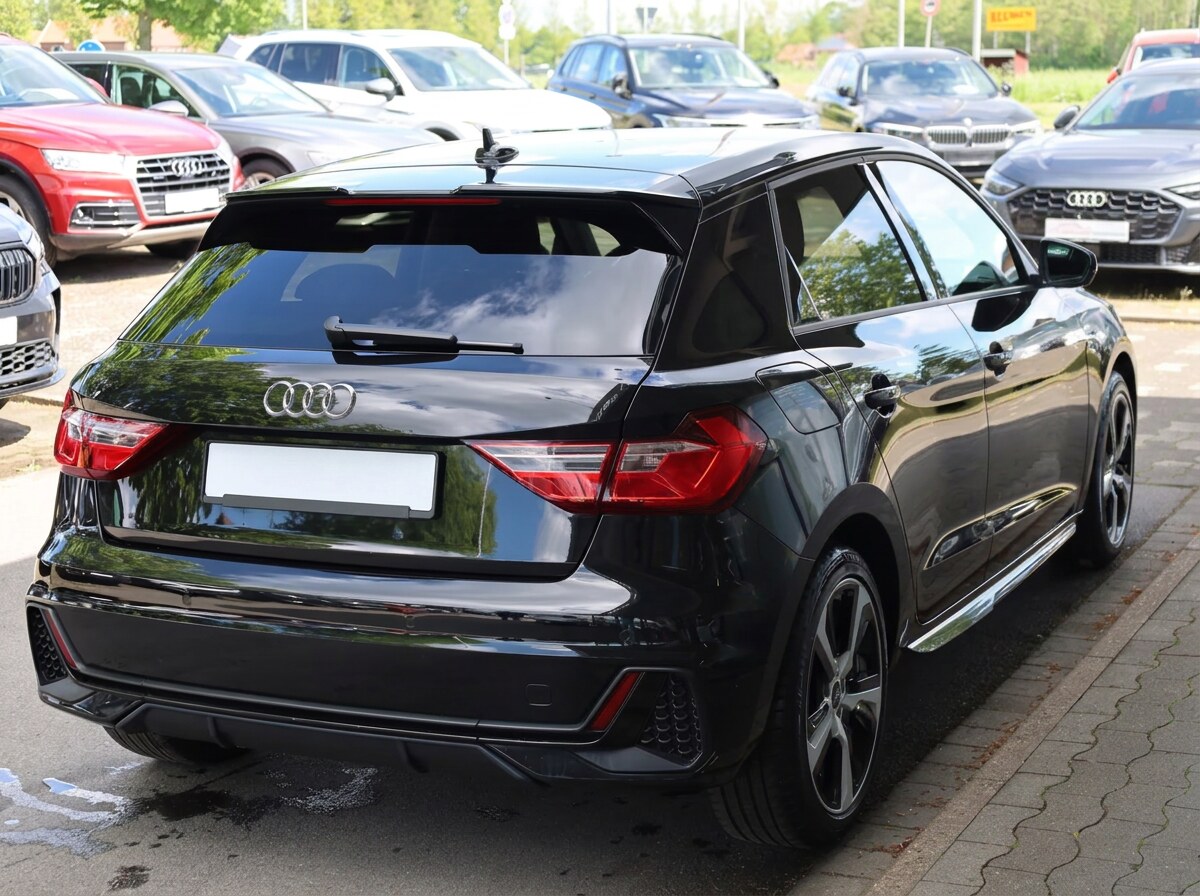 Rear view of the Audi A1 Sportback showing its roof spoiler and S line bumper.