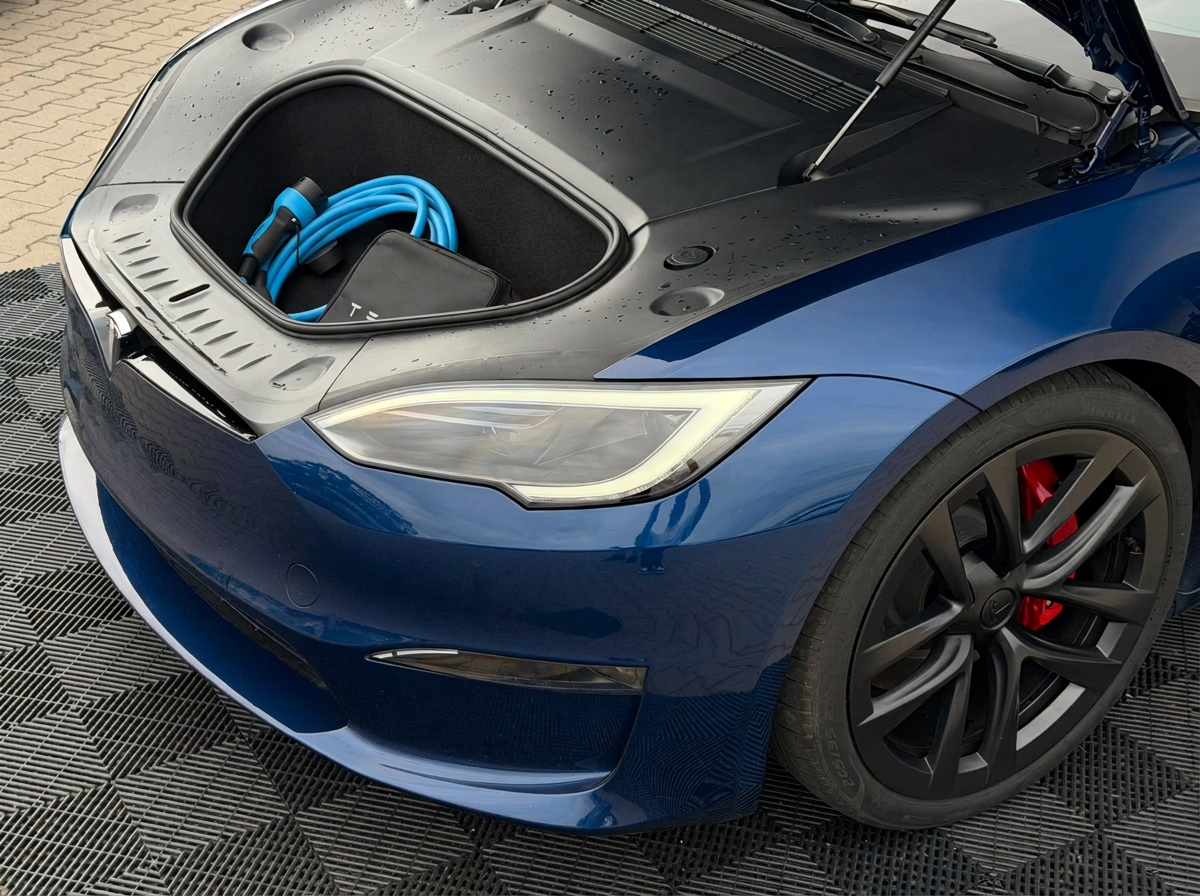 Open frunk of the Tesla Model S Plaid with charging cable.